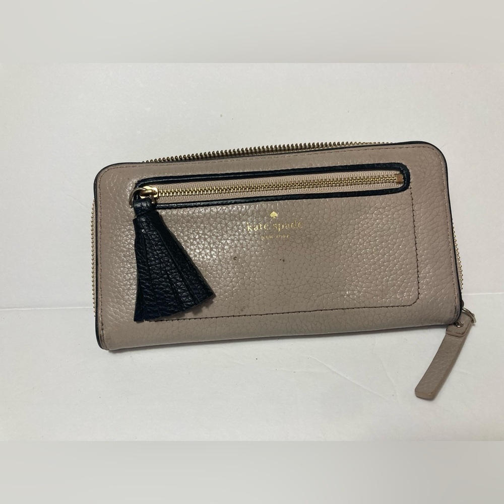 Kate Spade wallet pebble texture leather mauve color black trim tassel